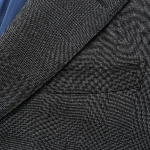 Close-up of a gray suit jacket with a pocket detail