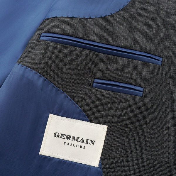 Gray suit jacket with blue lining and 'Germain Tailors' label